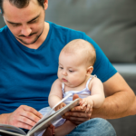 dad reading aloud to child