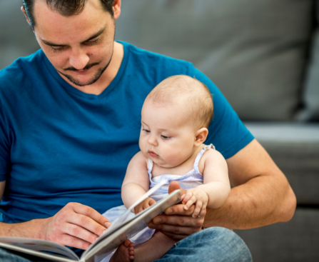 dad reading aloud to child